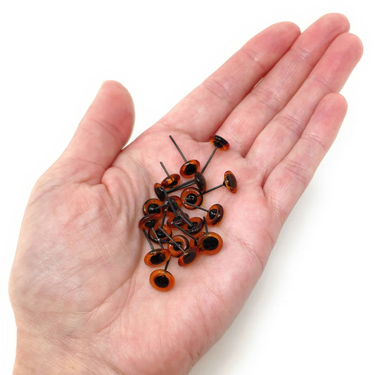 9mm amber glass eyes - 9g (approx 10 pairs)